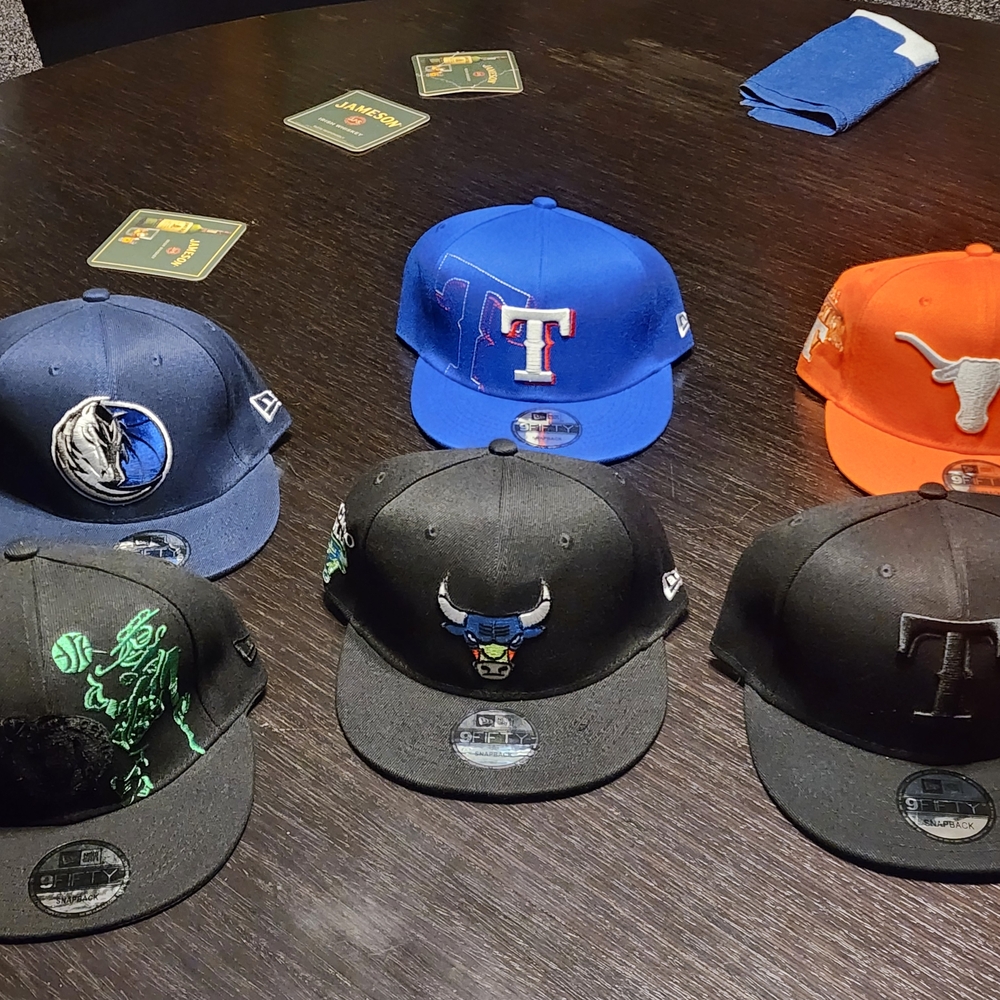 Men's Black and Blue Snapback Hat... $25 each